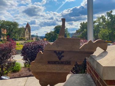 Wooden West Virginia plaque with Flying WV in middle